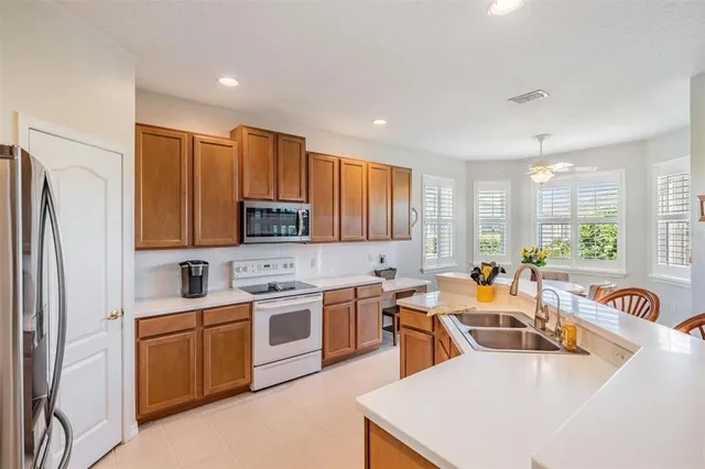a kitchen with lots of counter space sink and refrigerator