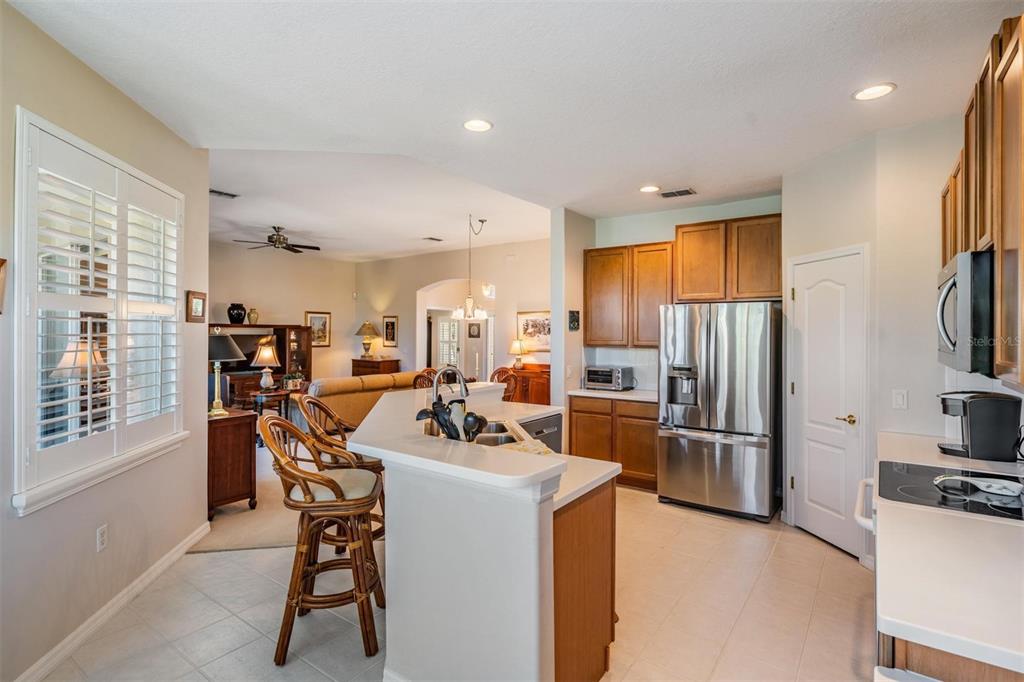 1630 Lakestone Drive Trinity, FL 34655 - Photo 8 of 49 a kitchen with a refrigerator and a stove top oven