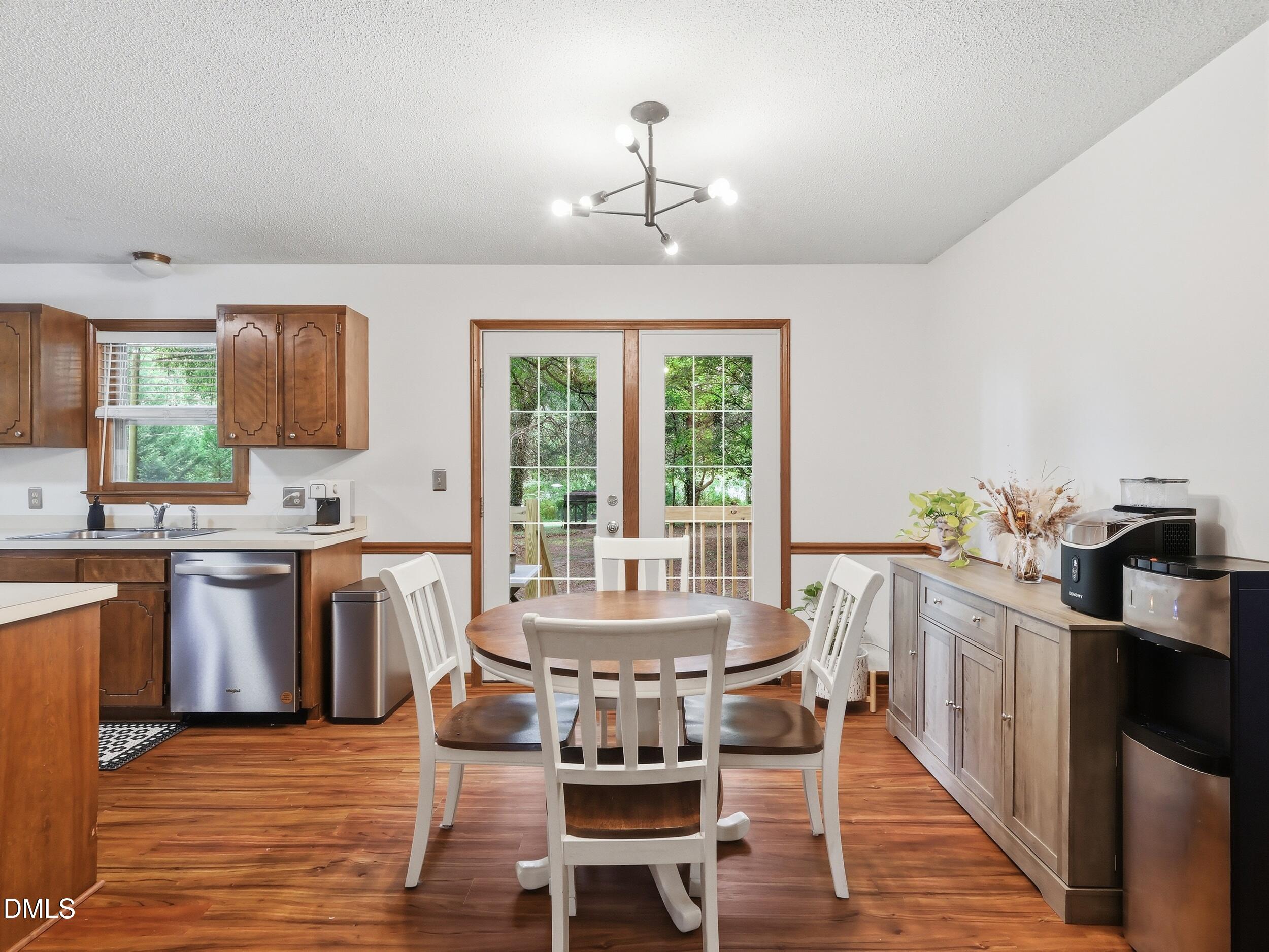 517 Lake Glad Road Wendell, NC 27591 - Photo 9 of 36 a view of a dining room with furniture window and wooden floor