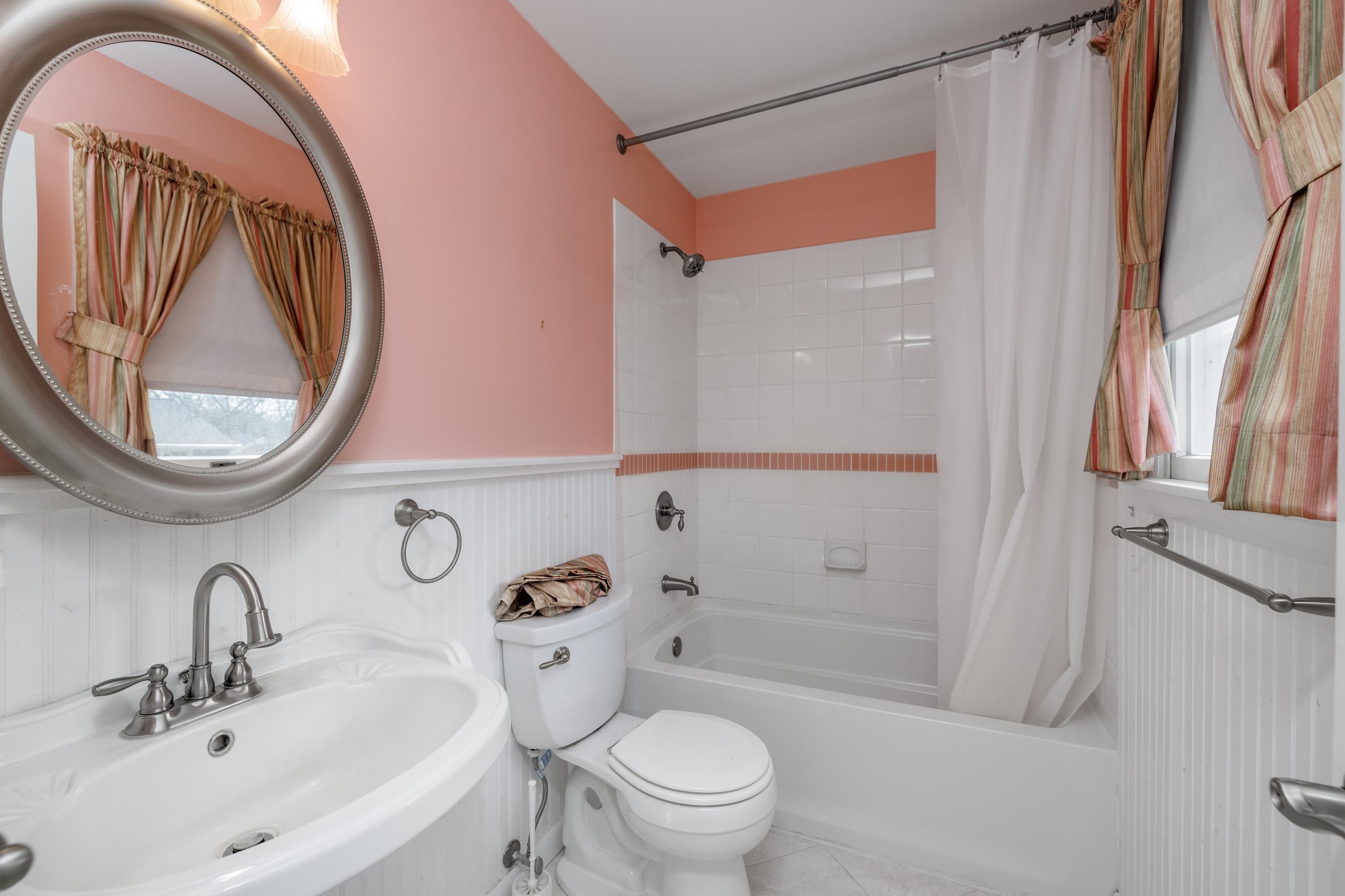 880 Honeysuckle Road Erma, NJ 08204 - Photo 22 of 31 a bathroom with a sink a mirror a toilet and a shower