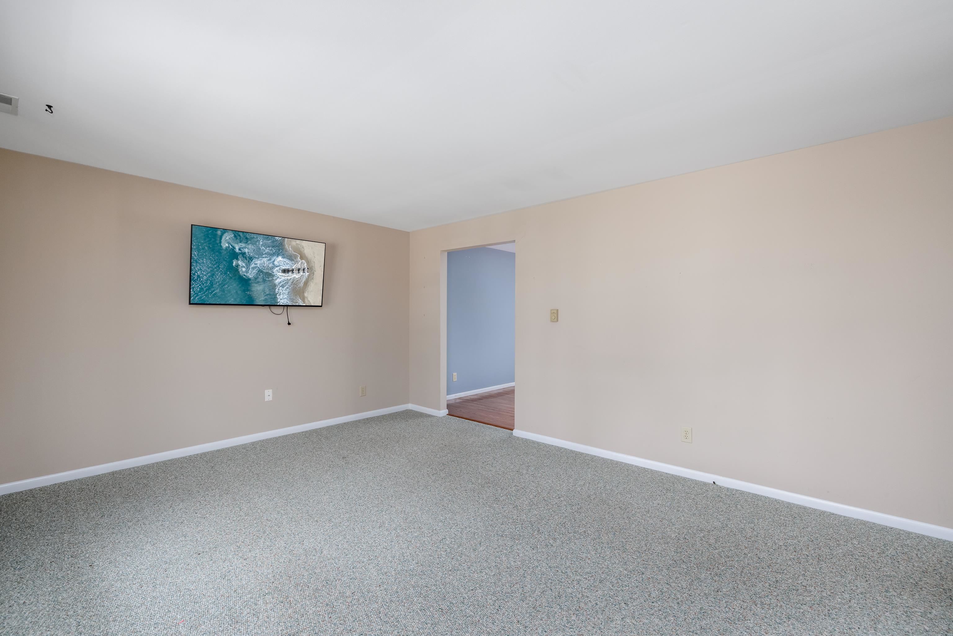 880 Honeysuckle Road Erma, NJ 08204 - Photo 8 of 31 a view of an empty room with a window