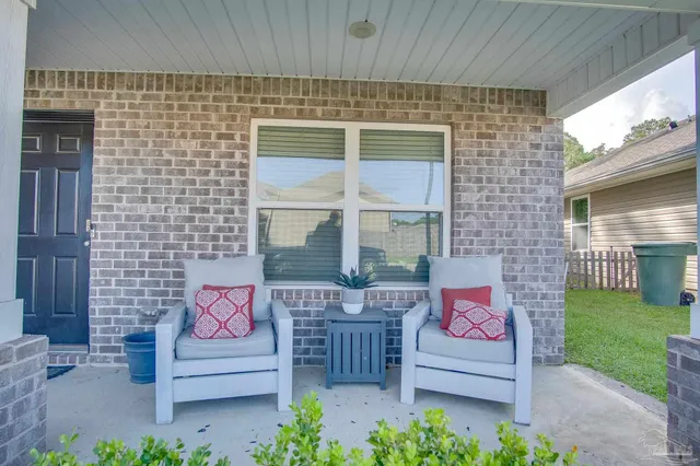 a outdoor space with view of a brick wall