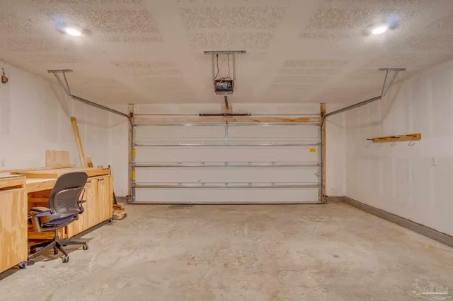 a yellow and red umbrella in front of a house