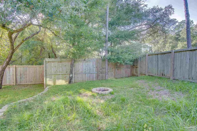 a view of a backyard with a trampoline