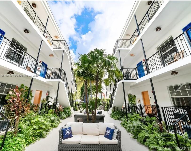1330 Pennsylvania Avenue, Unit 313 Miami Beach, FL 33139 - Photo 1 of 14 a view of a patio with couches and potted plants