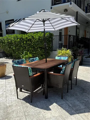 a patio with table and chairs