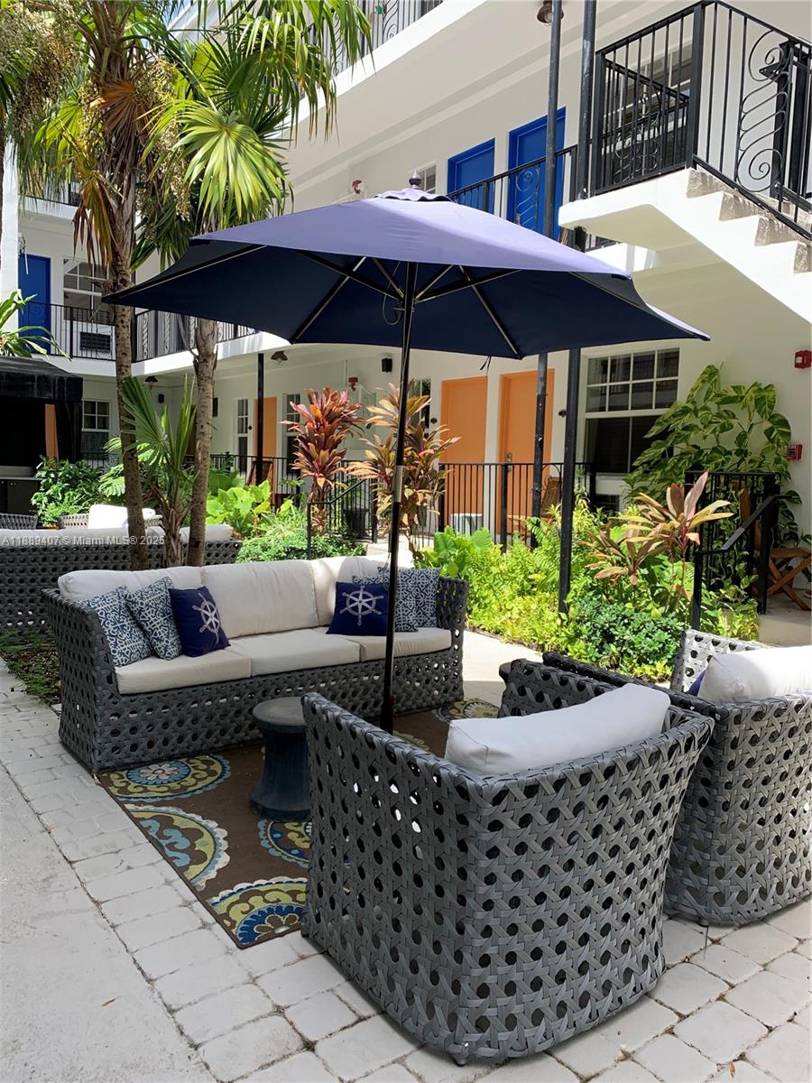 1330 Pennsylvania Avenue, Unit 313 Miami Beach, FL 33139 - Photo 5 of 14 a view of a chairs and tables in the patio