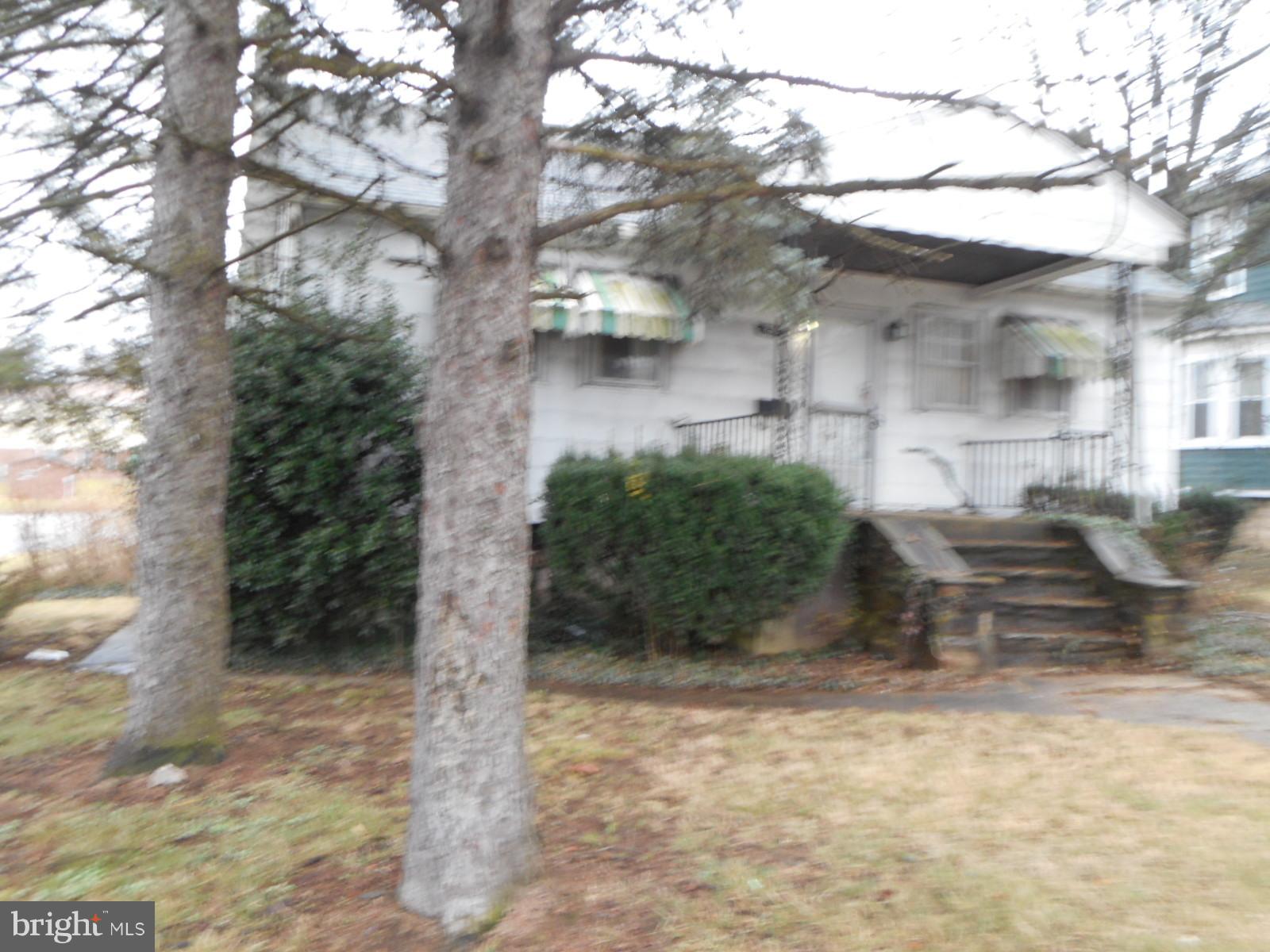 6501 Windsor Mill Road Baltimore, MD 21207 - Photo 1 of 17 a view of a yard with plants and large trees