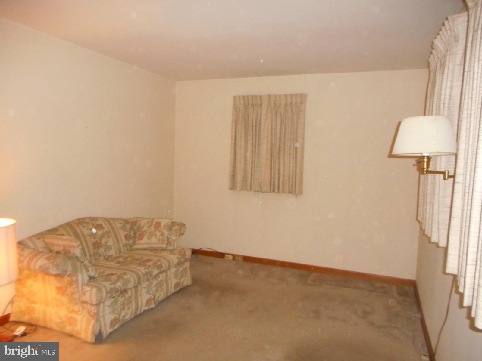 6501 Windsor Mill Road Baltimore, MD 21207 - Photo 9 of 17 a living room with a couch