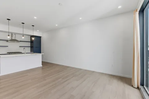 a view of kitchen with wooden floor