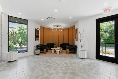 a view of a balcony furniture and rug
