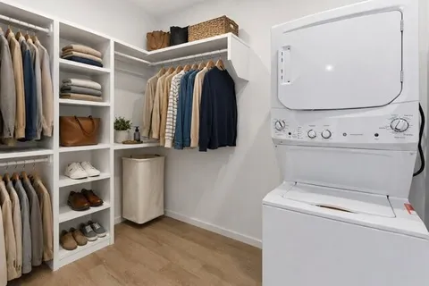 a view of storage and utility room with washer and dryer