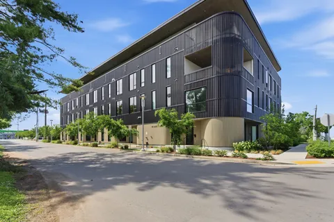 a front view of a building with street view