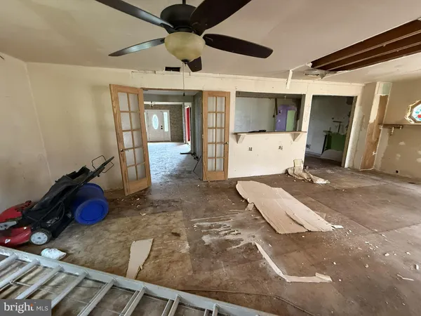 a bedroom with a bed and a mirror