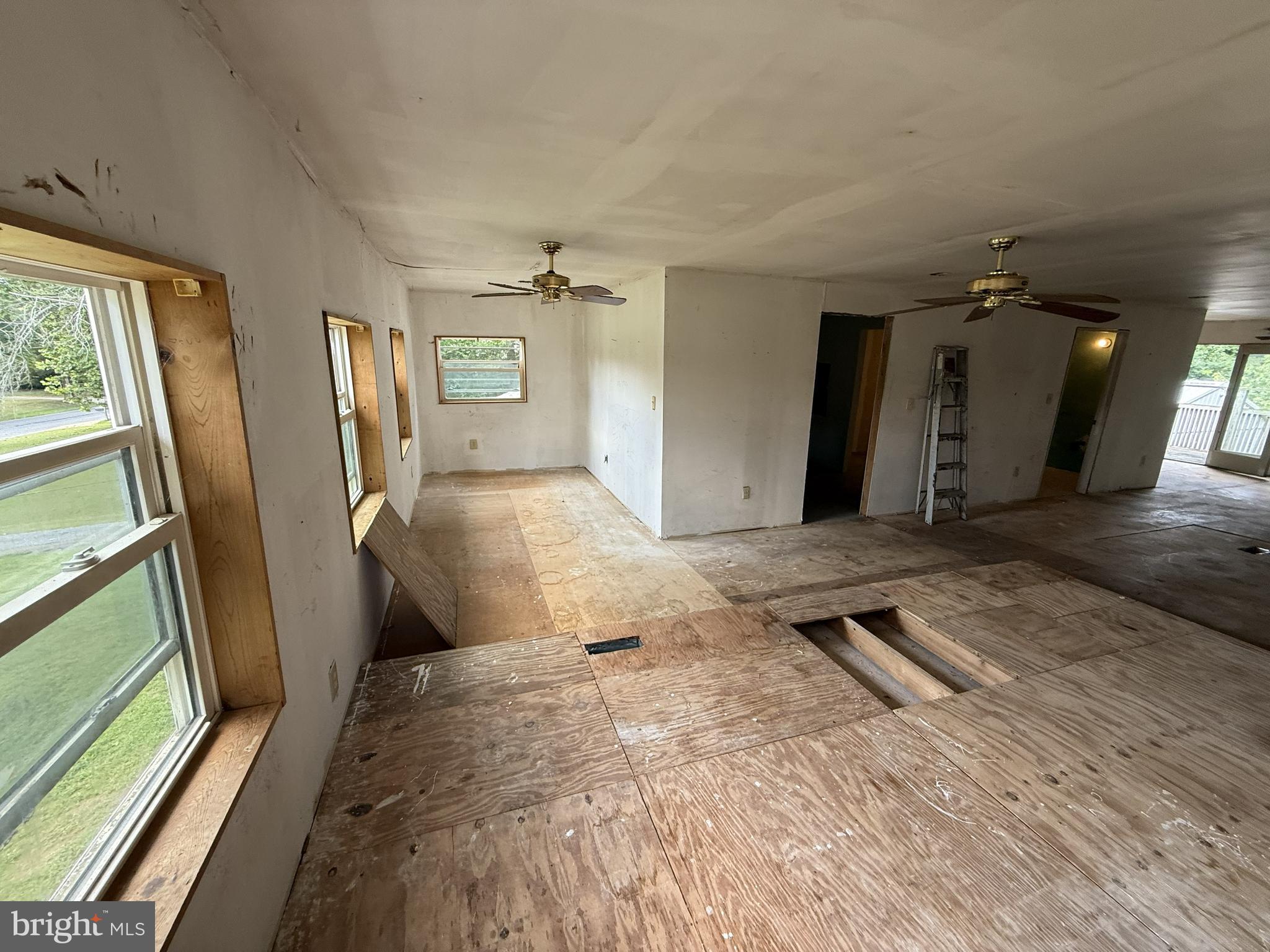 155 Silver Lake Road Bridgeton, NJ 08302 - Photo 15 of 36 a bedroom with a bed and a mirror