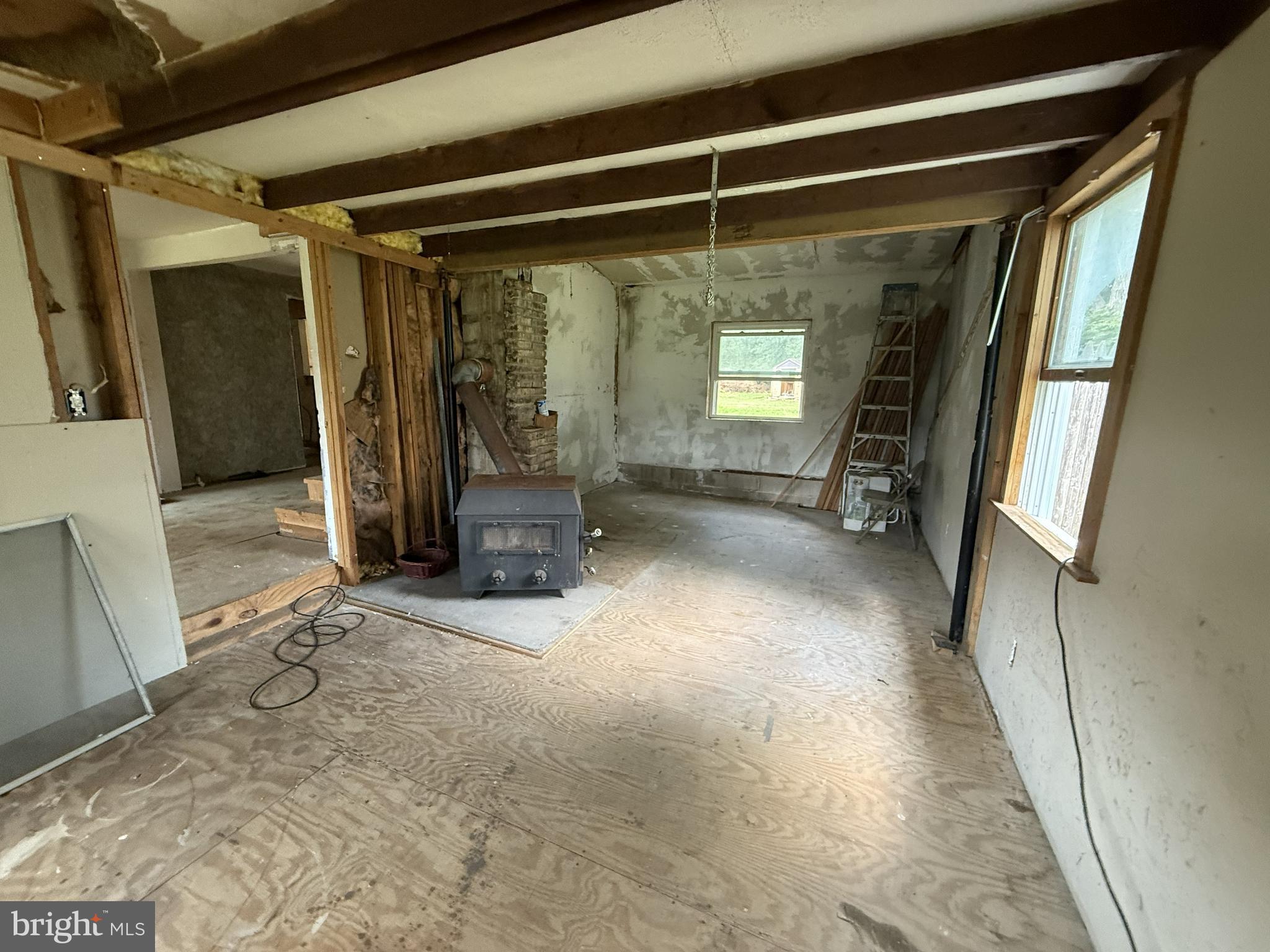 155 Silver Lake Road Bridgeton, NJ 08302 - Photo 16 of 36 a view of empty room with wooden floor and chair