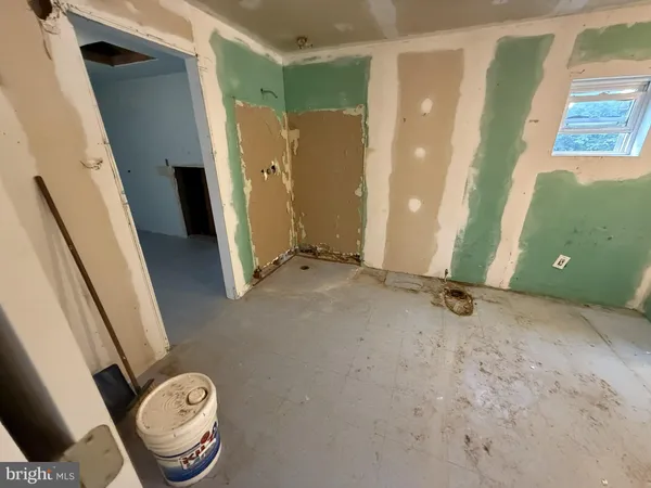 a view of a hallway with wooden shelves