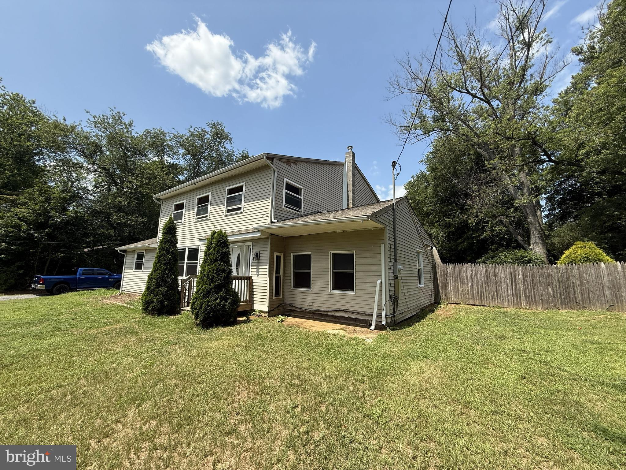 155 Silver Lake Road Bridgeton, NJ 08302 - Photo 2 of 36 a front view of house with yard and trees in the background