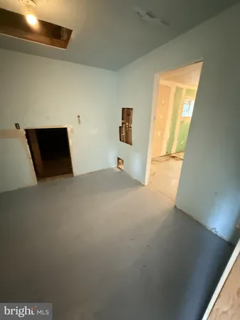 a view of a livingroom with furniture and a window