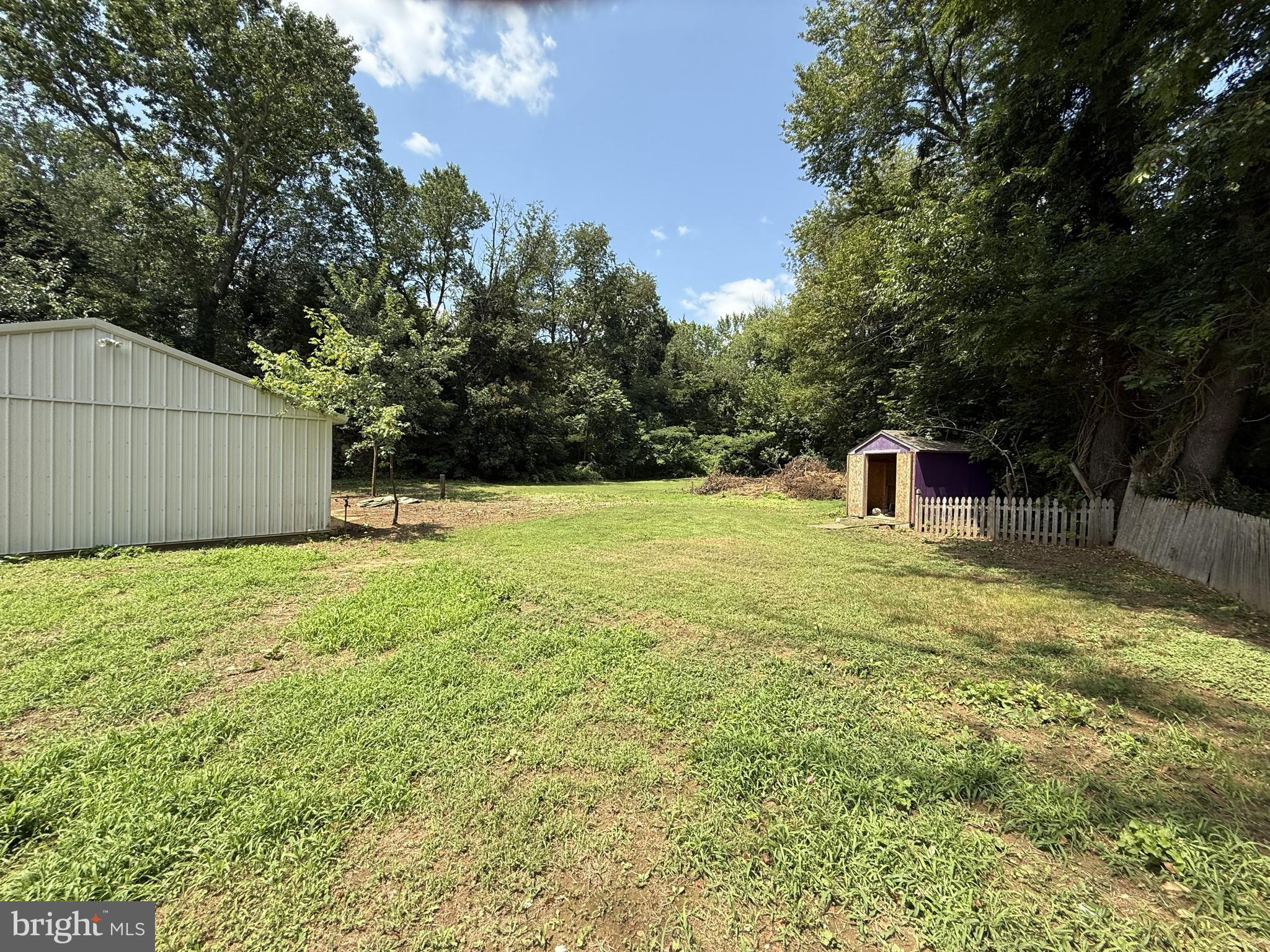 155 Silver Lake Road Bridgeton, NJ 08302 - Photo 4 of 36 a backyard of a house with table and chairs