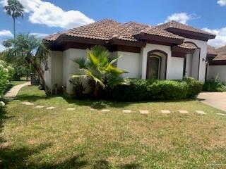 604 Avenida Morelos Rancho Viejo, TX 78575 - Photo 14 of 14 a view of a house with a small yard