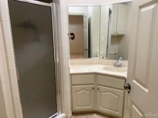 604 Avenida Morelos Rancho Viejo, TX 78575 - Photo 8 of 14 a bathroom with a sink and mirror