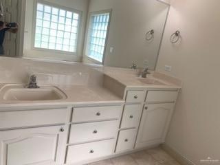 604 Avenida Morelos Rancho Viejo, TX 78575 - Photo 9 of 14 a bathroom with a sink and a mirror