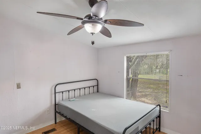 a view of a room that has a table and chair