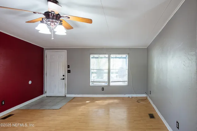a view of an empty room with a window