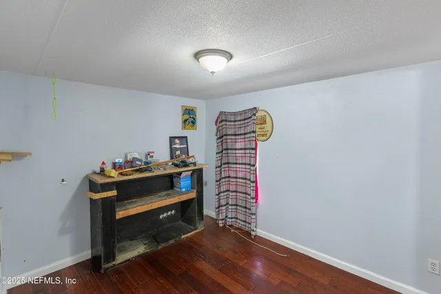 a bench sitting in a room next to a window