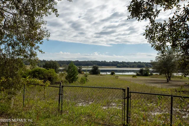 a view of swimming pool with a yard