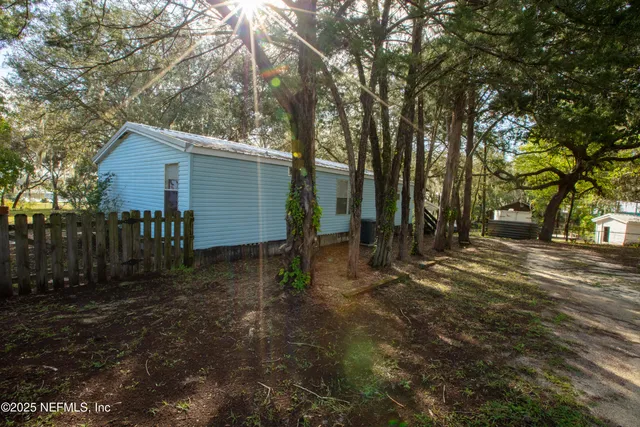 a backyard of a house with lots of green space