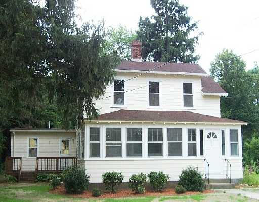 192 Concord Road Bedford, MA 01730 - Photo 1 of 1 a house that has a tree in front of it