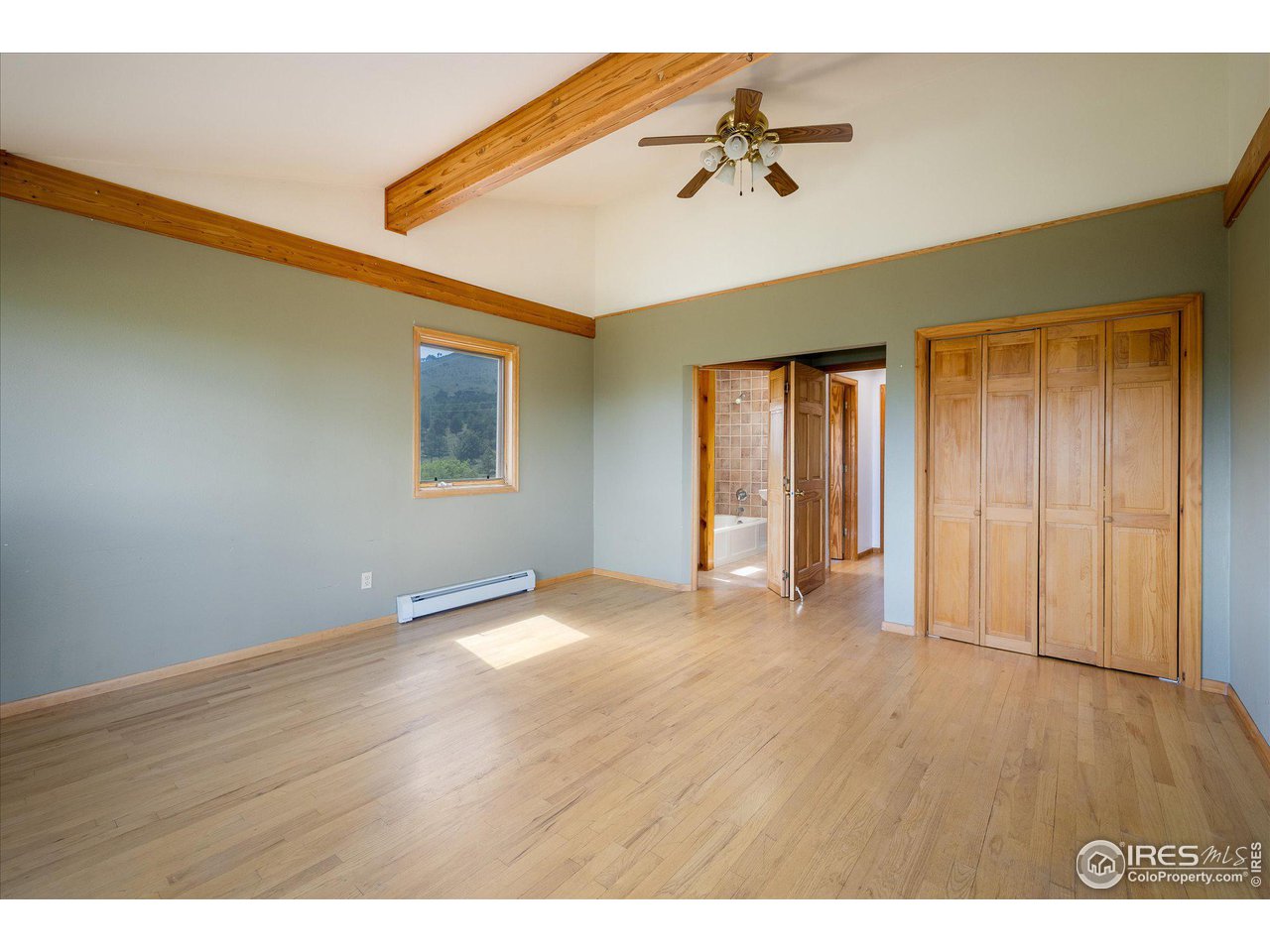 78 Old Post Office Road Boulder, CO 80302 - Photo 11 of 25 a view of an empty room with window and wooden floor