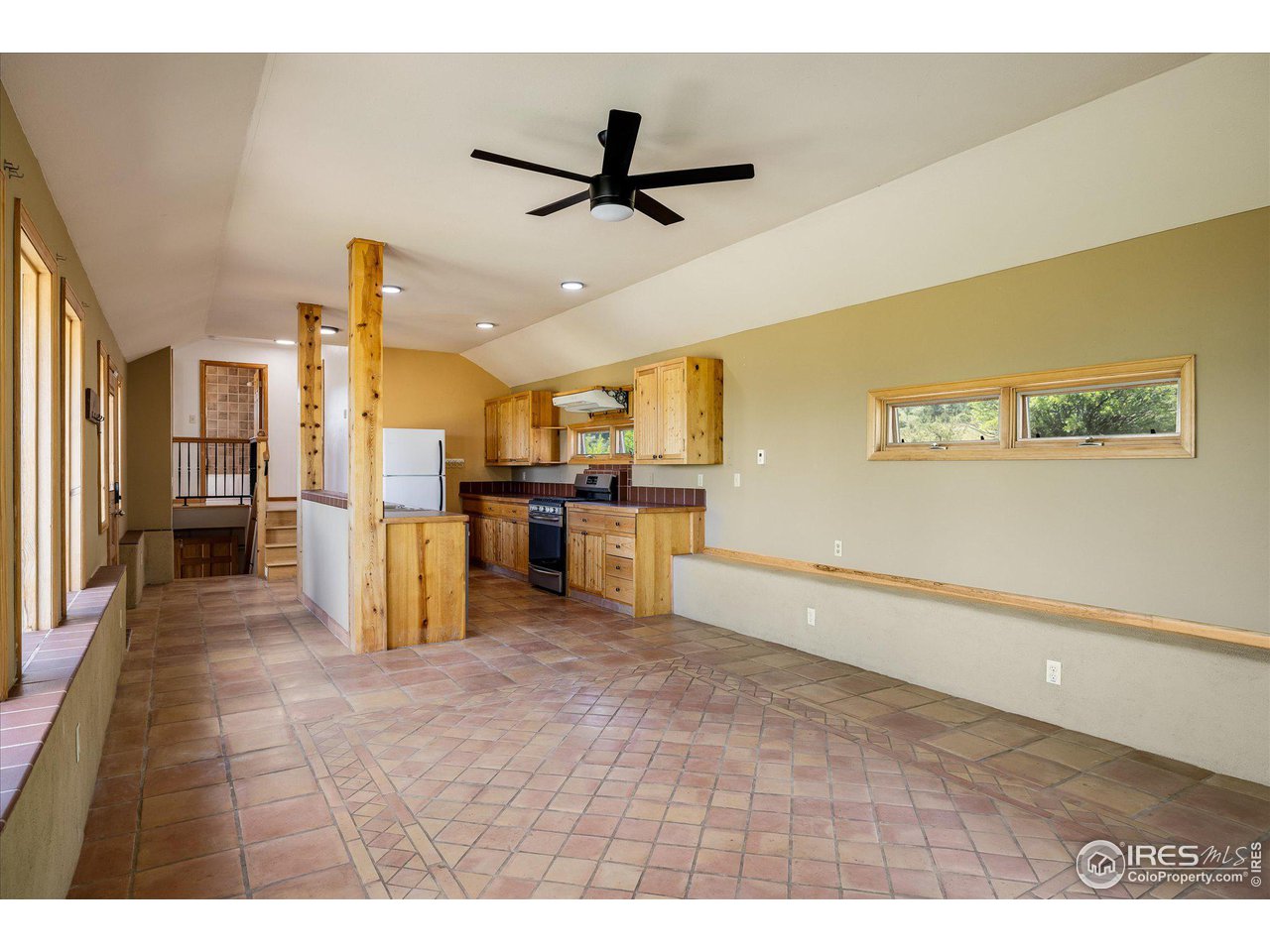 78 Old Post Office Road Boulder, CO 80302 - Photo 9 of 25 a view of a kitchen with kitchen island stainless steel appliances wooden floor dining table and chairs