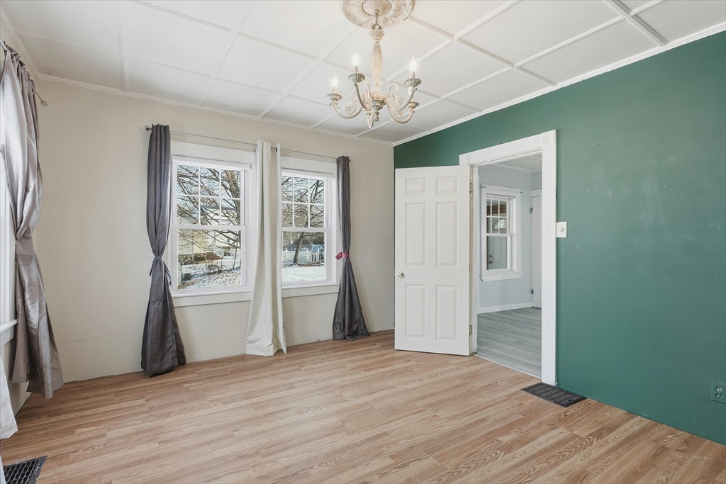 7 Mystic Street Methuen, MA 01844 - Photo 13 of 30 a view of empty room with wooden floor and fan