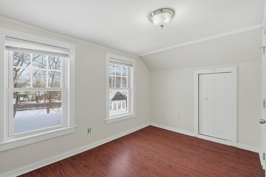 7 Mystic Street Methuen, MA 01844 - Photo 16 of 30 an empty room with wooden floor and windows