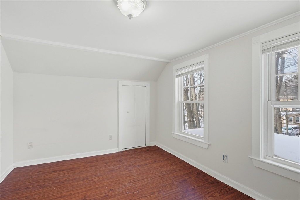7 Mystic Street Methuen, MA 01844 - Photo 18 of 30 a view of an empty room with wooden floor and a window