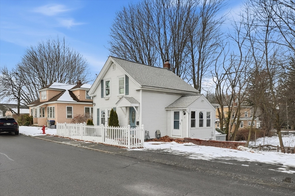 7 Mystic Street Methuen, MA 01844 - Photo 28 of 30 a view of a white house with a large tree
