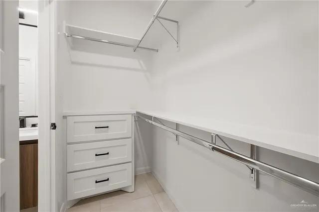 a view of an empty walk in closet