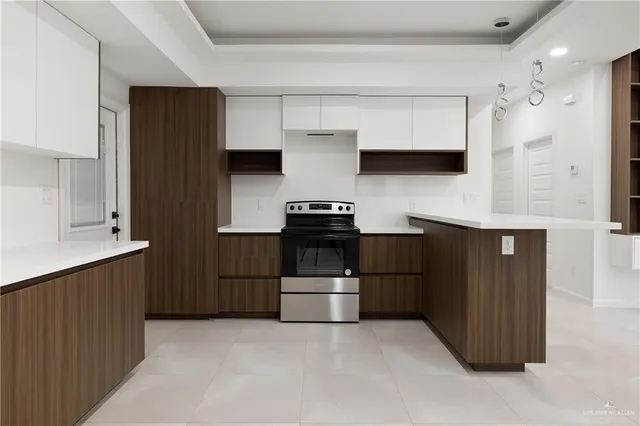 a kitchen with a refrigerator and a sink