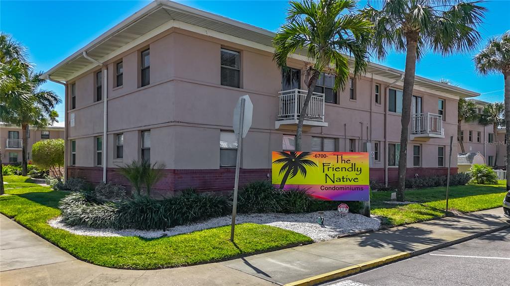 6700 Sunset Way, Unit 604 St. Pete Beach, FL 33706 - Photo 2 of 27 a view of house with outdoor space and swimming pool