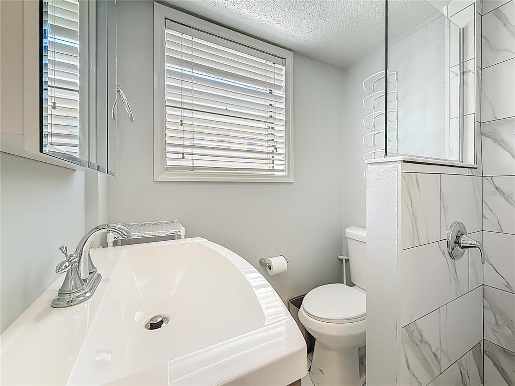 6700 Sunset Way, Unit 604 St. Pete Beach, FL 33706 - Photo 21 of 27 a bathroom with a sink and a toilet