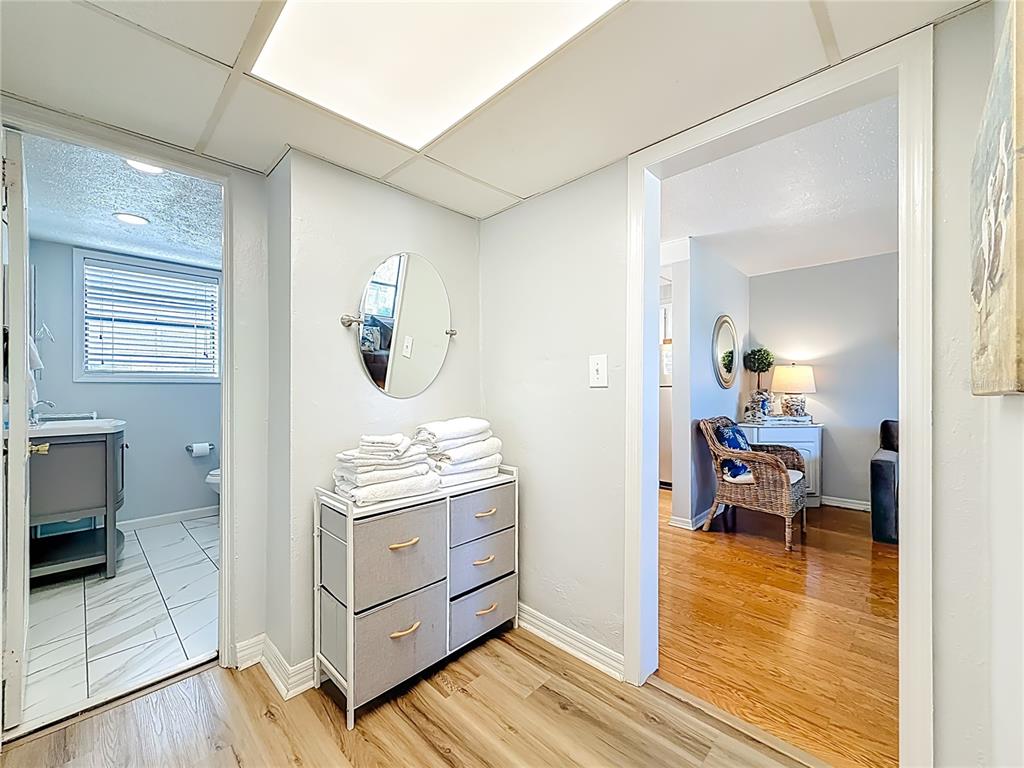 6700 Sunset Way, Unit 604 St. Pete Beach, FL 33706 - Photo 24 of 27 a view of a bedroom with wooden floor