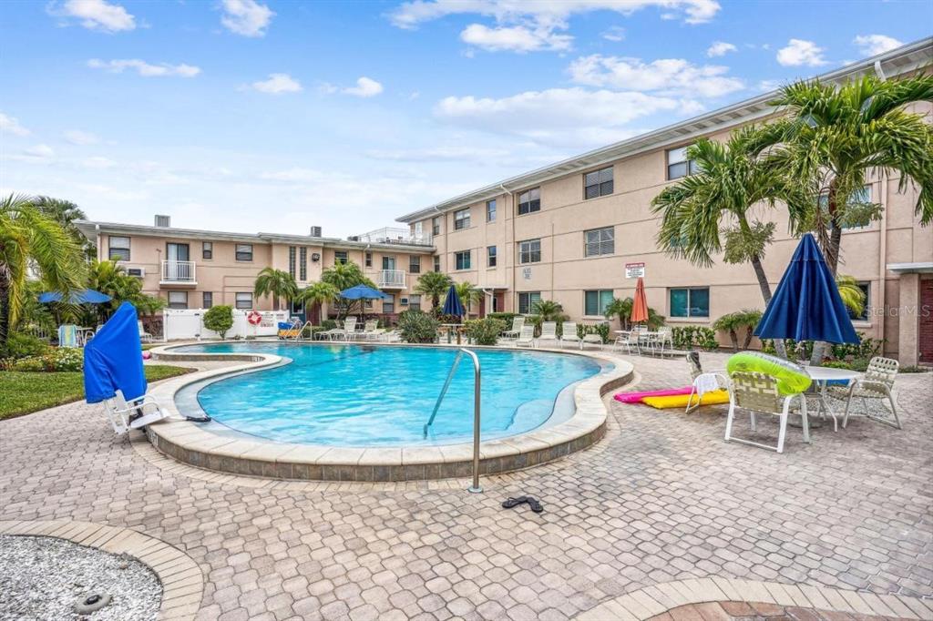 6700 Sunset Way, Unit 604 St. Pete Beach, FL 33706 - Photo 5 of 27 a view of outdoor space with seating