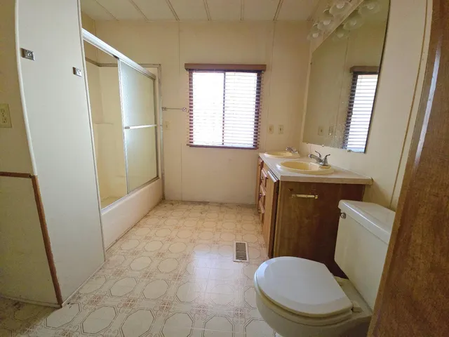 a bathroom with a toilet and a sink
