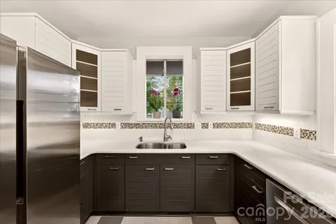a bathroom with a double vanity sink and mirror