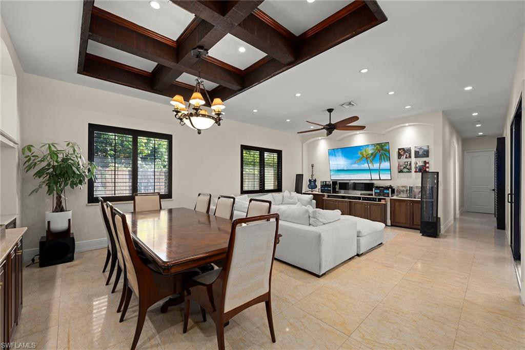 2605 64th Street Southwest Naples, FL 34105 - Photo 18 of 45 a view of a dining room with furniture
