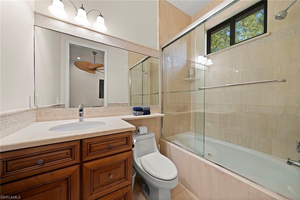 2605 64th Street Southwest Naples, FL 34105 - Photo 29 of 45 a bathroom with a sink toilet and shower