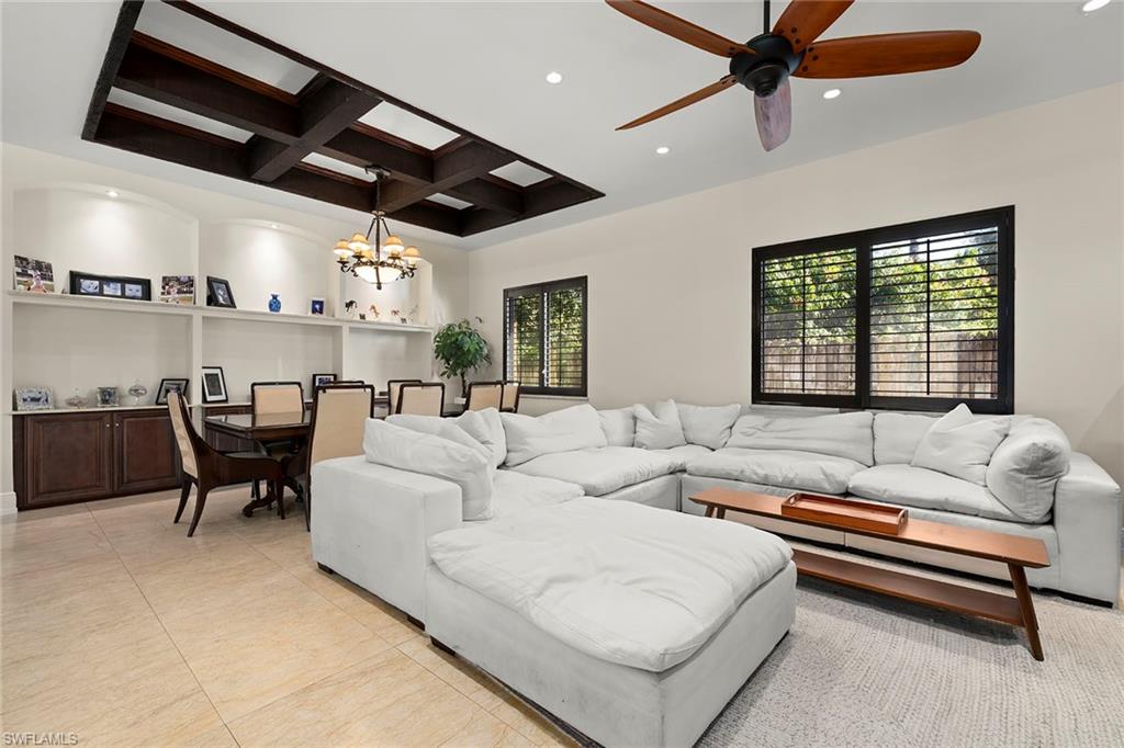 2605 64th Street Southwest Naples, FL 34105 - Photo 4 of 45 a living room with furniture and a large window